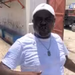 Jimmy-Barbecue-Cherizier-speaking-in-front-of-a-nonfunctional-Delmas-2-on-Apr-24-2021-by-Kim-Ives-Haiti-Liberte-696x507