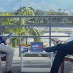 Manu Pineda interviewed by Ernesto Villegas in Caracas. Photo courtesy of Alba Ciudad.