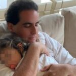 Alex Saab holding a baby. File photo.