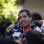 Former deputy Juan Guaido being surrounded by the press. File photo.