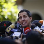 Former deputy Juan Guaido being surrounded by the press. File photo.