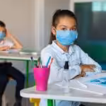 Venezuelan kids wearing face masks in a classroom. File photo.