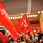 PSUV flags being hold by party members during a congress. File photo.