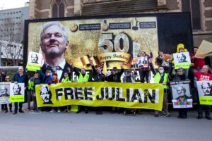 Julian Assange - Melbourne protest with big banner celebrating Assange birthday.