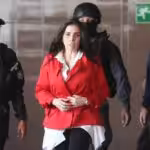Aida Merlano being escorted by Venezuelan law enforcement officers before being presented and giving testimony to Venezuelan judicial authorities. File photo.