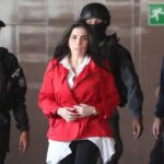 Aida Merlano being escorted by Venezuelan law enforcement officers before being presented and giving testimony to Venezuelan judicial authorities. File photo.