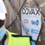 A COVAX-GAVI tag on a shipment of COVID-19 vaccines at the Kotoka International Airport in Accra. Photo by NIPAH DENNIS/AFP via Getty Images.