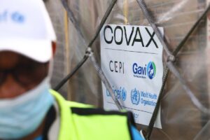 A COVAX-GAVI tag on a shipment of COVID-19 vaccines at the Kotoka International Airport in Accra. Photo by NIPAH DENNIS/AFP via Getty Images.