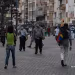 Venezuelans wearing face masks walking in a boulevard at Caracas. File photo.