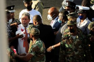 St. Vincent and the Grenadines Prime Minister Ralph Gonsalves, his shirt covered in blood, is evacuated after media reported that he was hit by a stone during a protest in Kingstown, St. Vincent and the Grenadines August 5, 2021. REUTERS/Robertson S. Henry