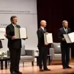 Parties in the Mexico Talks showing their copy of the signed memoranda opening the new dialogue with Venezuela's extreme right opposition. Photo courtesy of Telesur.