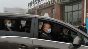 Peter Daszak, right, Thea Fischer, left, and other members of the World Health Organization team investigating the origins of the COVID-19 pandemic arrive at the Wuhan Institute of Virology in Wuhan in China’s central Hubei province on Feb. 3, 2021. (Hector Retamal / AFP / Getty Images).