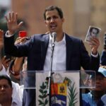Juan Guaido declared himself president at the end of an opposition march in Caracas and escorted by Edgar Zambrano (AD) and Stalin Gonzalez (Primero Justicia), both of them already active in the regional election race. Photo courtesy of AP.