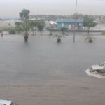 An SUV passing by a flooded road in La Guaira during heavy rains reported on Saturday, August 28. Photo courtesy of Twitter.