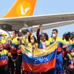 Venezuelan Paralympic athletes being received as heroes. Lisbeli Vera the top medalist in front of the mic. Photo courtesy of Conviasa.