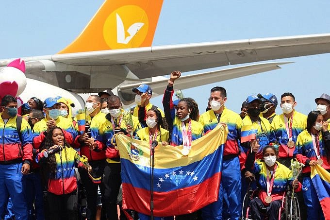 Venezuelan Paralympic athletes being received as heroes. Lisbeli Vera the top medalist in front of the mic. Photo courtesy of Conviasa.