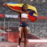 Lisbeli Vera holding the Venezuelan flag after wining her third Paralympic medal Tokyo 2020. Photo courtesy of Getty Images.