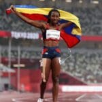 Lisbeli Vera holding the Venezuelan flag after wining her third Paralympic medal Tokyo 2020. Photo courtesy of Getty Images.