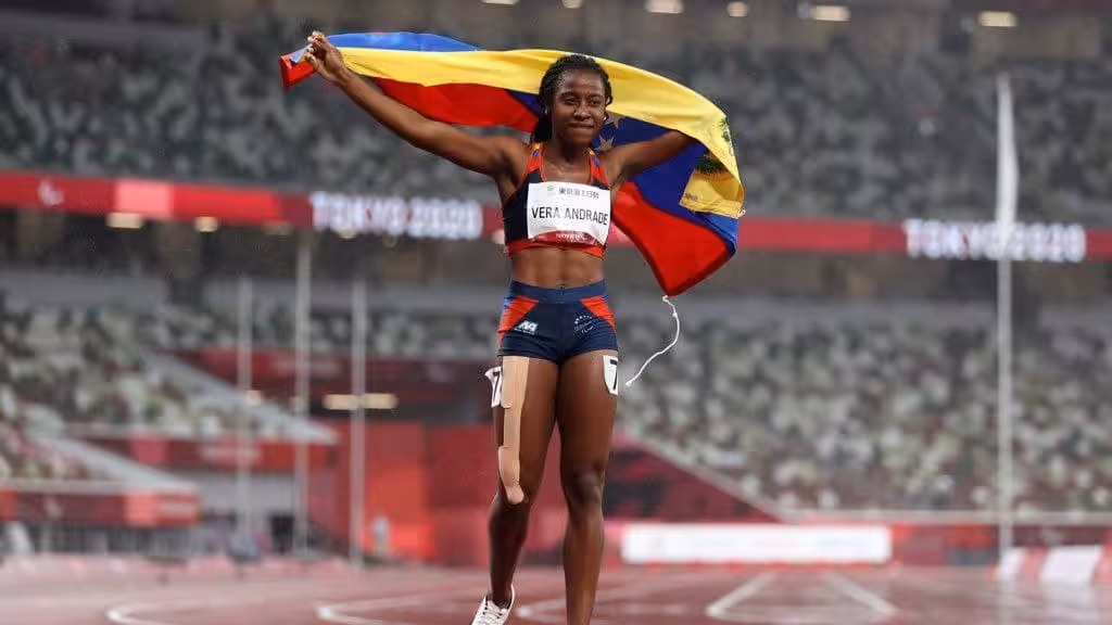 Lisbeli Vera holding the Venezuelan flag after wining her third Paralympic medal Tokyo 2020. Photo courtesy of Getty Images.