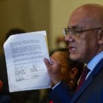 Jorge Rodriguez showing the memorandum that formalized the launching of Mexico Talks File photo.