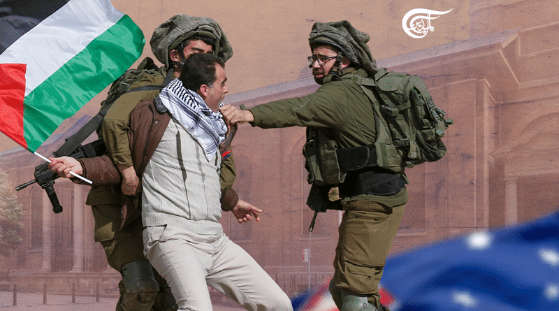 Man carrying a Palestinian flag being repressed by IDF gendarmes. Photo courtesy of Al Mayadeen English.