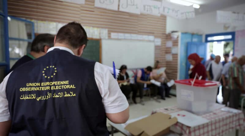 Observers from the European Union monitor the election process inside a polling station outside Tunis during the first round of the presidential election on September 15, 2019. (Mosa’ab Elshamy/AP).