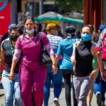 Venezuelans responsibly wearing face mask in public places to fight COVID-19. File photo.