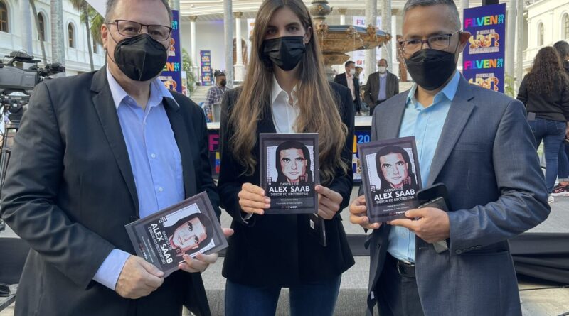 Alex Saab's wife Camila Fabri holding the book "Letters from Alex Saab since his Kidnapping" (center), Minister for Culture Ernesto Villegas (right) and Venezuela's National Book Center president, Raúl Cazal (left). Photo courtesy of Twitter /@PedroKonductaz.