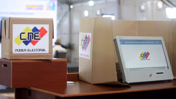 Venezuelan voting machine next to a ballot box. File photo.