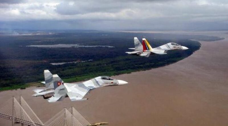 Two Venezuelan Su-32 fighter jets flying over the Orinoco river near Ciudad Guayana. Referential photo.