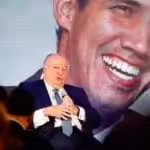 Former Guaido's  "ambassador" to Bogota during a speech with an image of former deputy Guaido in the background. File photo.