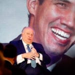 Former Guaido's  "ambassador" to Bogota during a speech with an image of former deputy Guaido in the background. File photo.