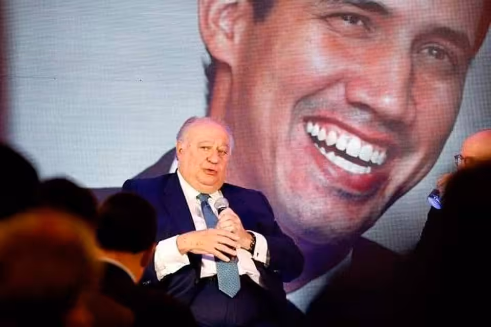 Former Guaido's  "ambassador" to Bogota during a speech with an image of former deputy Guaido in the background. File photo.
