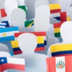 Photo composition of blank figurines holding flags of Latin American countries. Photo by RedRadioVE.