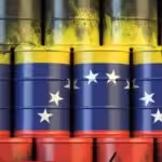 Photo composition representing barrels with the Venezuelan flag stamped on them. File photo.