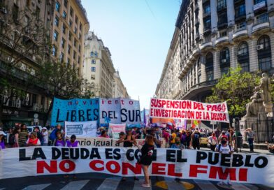 Protesters hold a banner that says 'The debt is with the people, not with the IMF' as they rally in Buenos Aires, Argentina on December 11, 2021. Photo: Natalie Alcoba/Al Jazeera