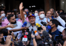 Opposition governor-elect of Barinas state, Sergio Garrido, is surrounded by the press as he leaves a Mass the day after elections in Barinas, Venezuela, January 10, 2022. Photo: Matias Delacroix / AP