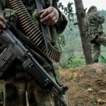 Paramilitary soldiers showing their weapons and ammunition in the Colombian jungle. Paramilitary gangs, former guerrilla groups and active guerrillas are the environment were endemic violence is cultivated in Colombia with a Civil War lasting more than 6 decades. File photo.
