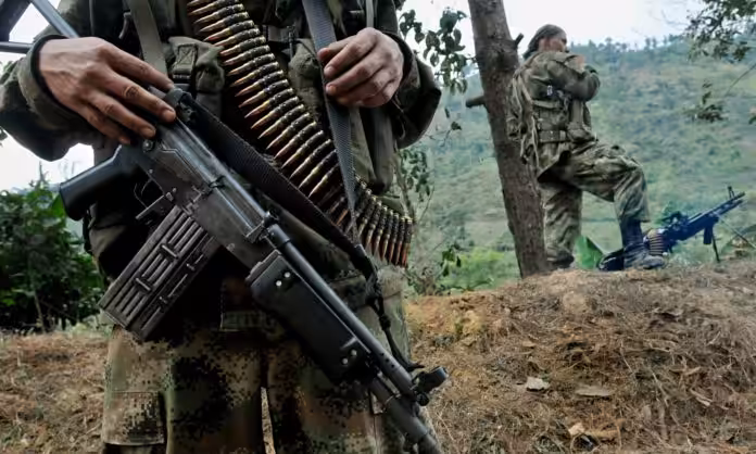 Paramilitary soldiers showing their weapons and ammunition in the Colombian jungle. Paramilitary gangs, former guerrilla groups and active guerrillas are the environment were endemic violence is cultivated in Colombia with a Civil War lasting more than 6 decades. File photo.