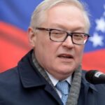 Russian Deputy Foreign Affairs Minister Sergey Riabkov with the Venezuelan and the Russian flag in the background. File photo.