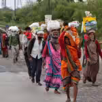 Migrant workers in New Delhi, India, walking through the highways to return to their villages in Uttar Pradesh, after country-wide lockdown was declared in late March 2020. Millions of such workers, who are rural migrants to urban centers, were forced to walk hundreds of kilometers as a nation of 1.37 billion people was closed down on a four-hour notice. Photo: Danish Siddiqui / Reuters