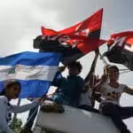 Young Sandinista supporters at the Juan Pablo II plaza, in Managua, Nicaragua, celebrating 39th anniversary of the Sandinista Revolution, on July 19, 2018. Photo: AP / Cristobal Venegas