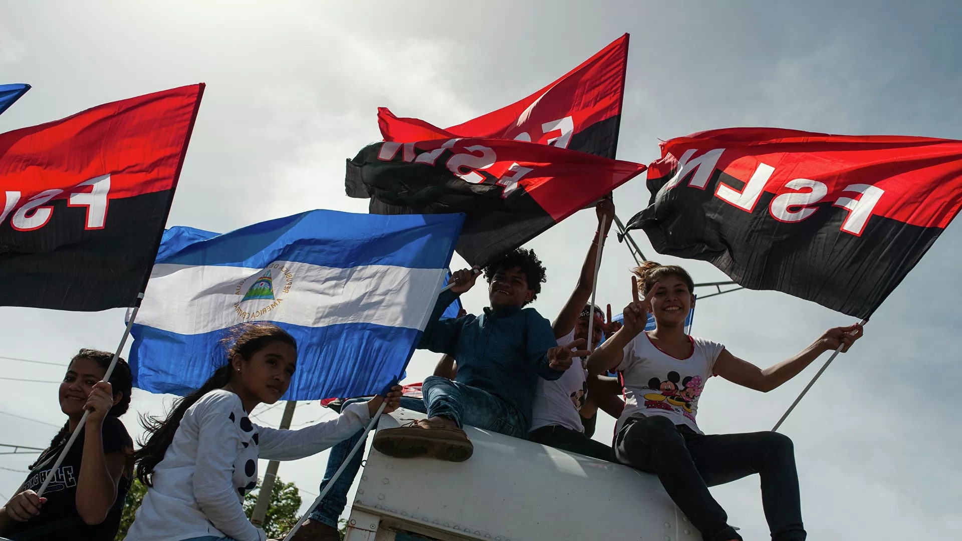 Young Sandinista supporters at the Juan Pablo II plaza, in Managua, Nicaragua, celebrating 39th anniversary of the Sandinista Revolution, on July 19, 2018. Photo: AP / Cristobal Venegas