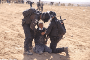 Palestinians protesting against land confiscation in the Negev desert region, being repressed by Israeli occupation forces. Photo: ActiveStills.org
