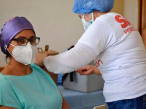 enezuelan healthcare worker being vaccinated. File photo by Telesur.