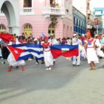 Fiesta del Fuego dancers in Santiago de Cuba holding the Cuban and the Haitian flags. File photo by SabordelCaribe blog.