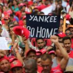 A person holds a banner reading "Yankee Go Home" at an anti-imperialist demonstration in Venezuela. File photo.