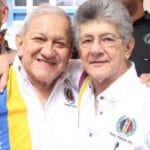 Bernabe Gutiérrez (left) and Henry Ramos Allup (right) embracing each other. File photo.