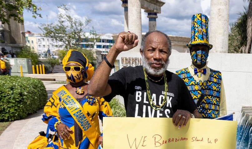 Featured image: Activist David Denny, of the Caribbean Movement for Peace and Integration, photographed during a November 2021 demo in Barbados. Credit: Mirror.