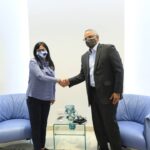 Venezuelan Vice President Delcy Rodriguez (left) greeting Belize's Foreign Affairs Minister Raul Li Causi (right). Photo: Twitter / @PartidoPSUV.